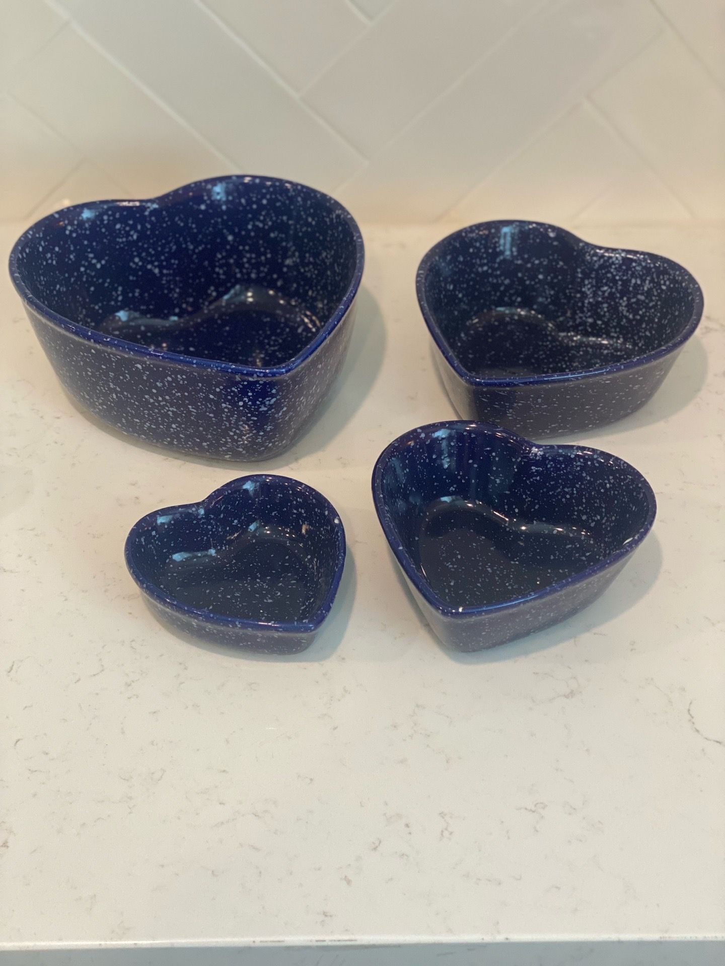 set of four vintage cobalt blue speckled by ceramic nesting bowls in a heart shape