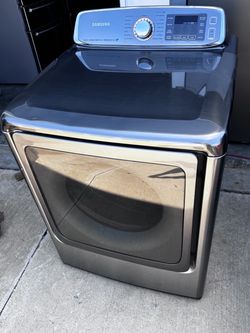 Graphite steel Samsung dryer mega capacity 9.5 cu.ft  working perfectly. Extra for delivery . same day delivery and installation available
