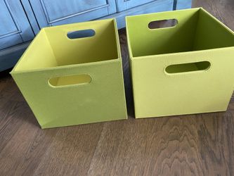 2 green storage boxes