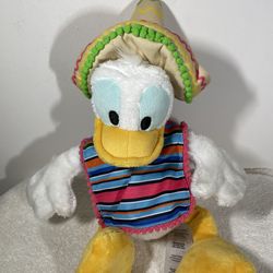 a Disney Parks Caballero Donald Duck plush from the Mexico pavilion