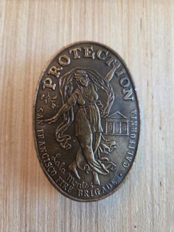Vintage San Francisco Fire Brigade “Protection” belt buckle featuring Lola Montez design.