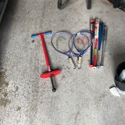 Wilson tennis racket.  Baseball metal  bats and glove.  pogo stick