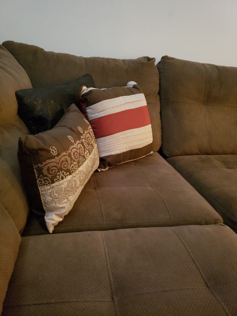 Brown microfiber sectional couch/loveseat. Comes from a1 owner home and does not smoke. ASKING $425.00 NO DELIVERY JUST PICKUP