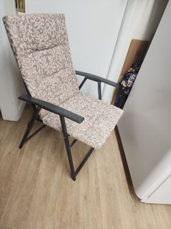 2 cushioned folding chairs