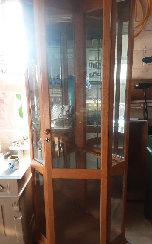 Solid Wood Curio Cabinate. Fits In Corner 7 Or 8 Glass Shelves Great Shape Lited Must Pick Up Has A Lock On Door