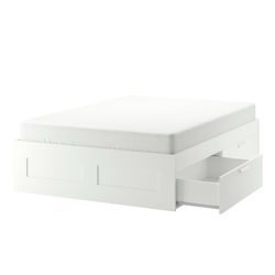 Full white bed with storage