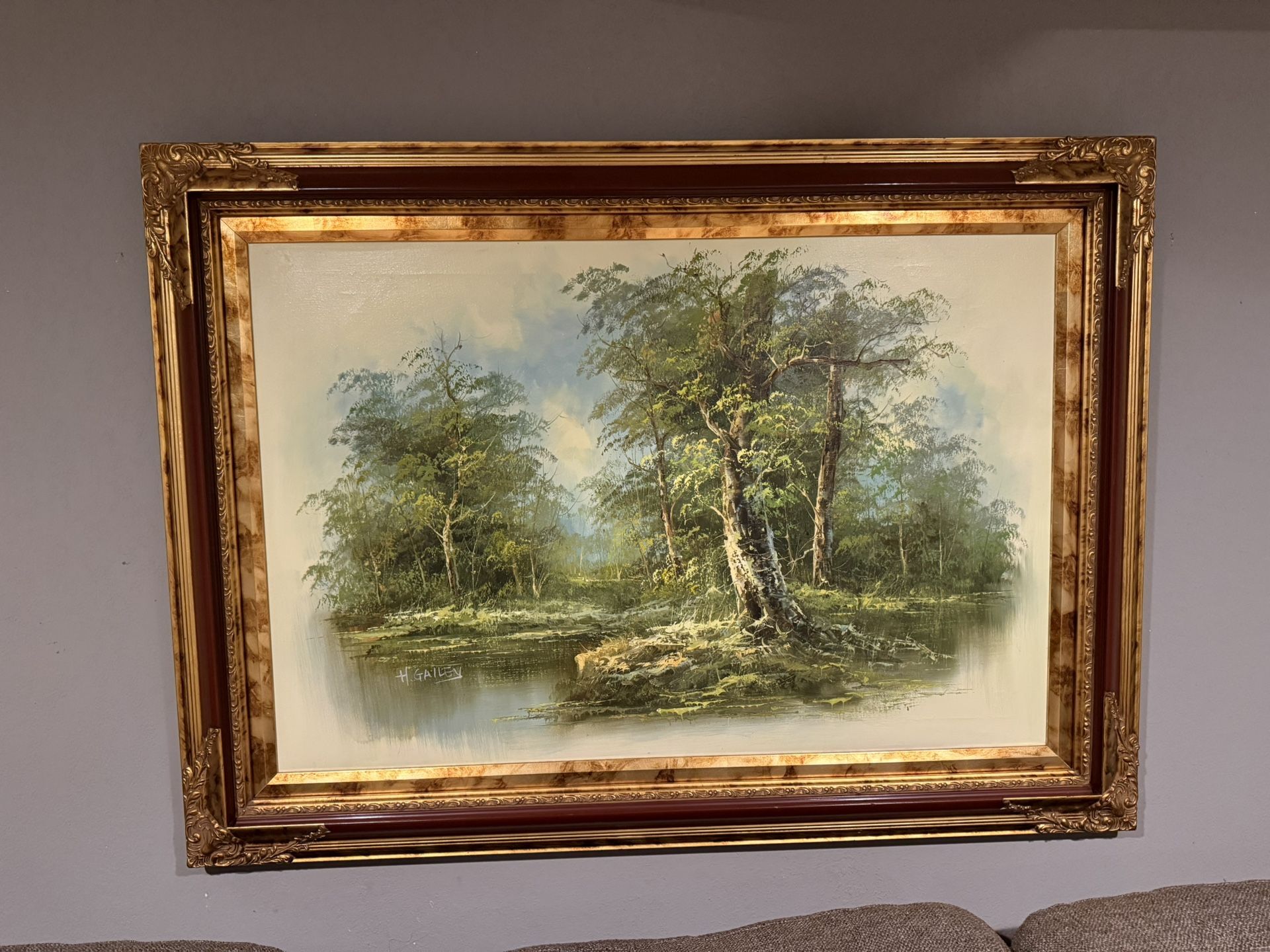 Vintage American Impressionist oil painting of a wooded landscape with a river