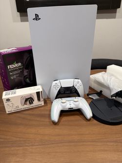 Sony PlayStation 5 Console with Two Controllers, and headphones along with a charging station