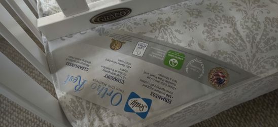 Graco baby crib, toddler bed and mattress in one.