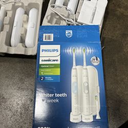 Philips sonicare Optimal Clean-2 handles, 2 chargers, 2 travel cases