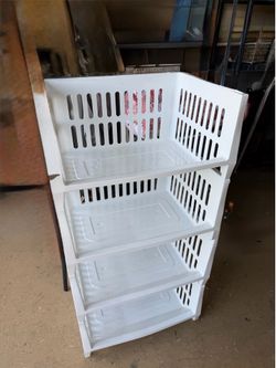Set of four large stackable nearly new storage bins