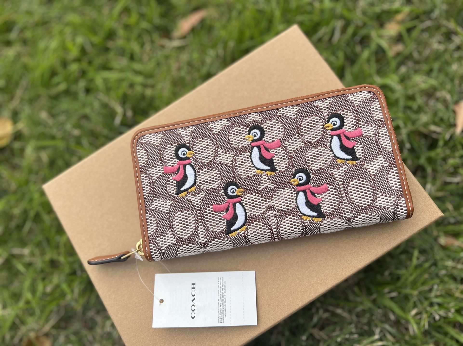 Coach Accordion Zip Wallet In Signature Textile Jacquard With Penguin Motif