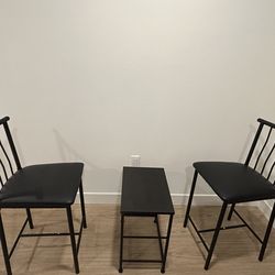 Stylish set of 2 black chairs and a black table