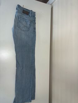 light blue buckle bke jeans