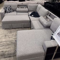 Beautiful Sectional With Pull Out Bed ,storage And Cup Holders 