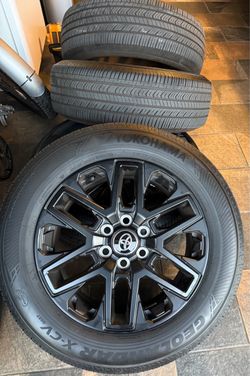 20” Toyota Tundra factory black wheels with tires