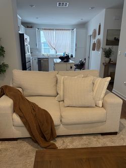 Cream Fabric Loveseat with Accent Pillows- Ashley furniture couch