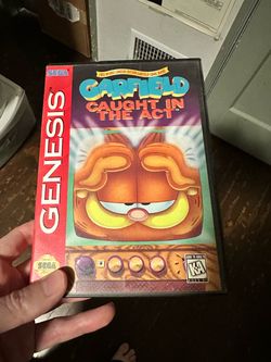 Garfield Caught in the Act Sega Genesis box and Manuel