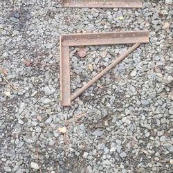 Concrete forming brackets and construction fencing