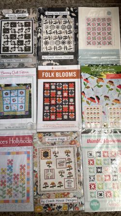 Assorted flower themed quilt patterns, nine packages