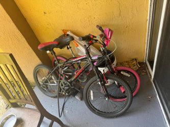 1 old bicycle  , 1 New bicycle with a big seat and a lock