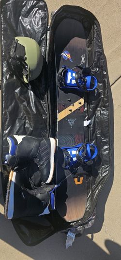 Head Daymaker 59 series snowboard with boots, helmet, and bag