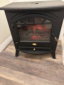 Used Charmglow electric fireplace heather