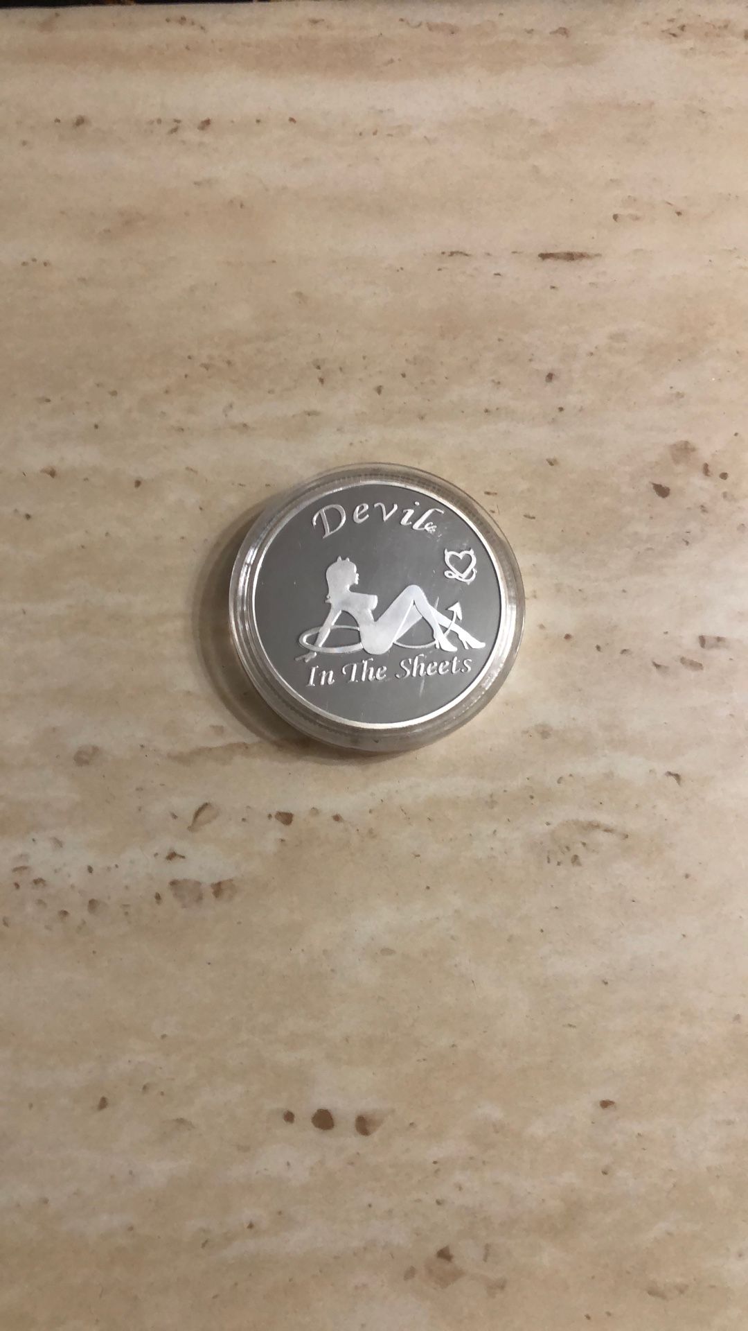 Silver Coin. Plastic Cover Comes Off.
