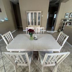 Matching oak dining room table, buffet, and hutch, six chairs and table leaf extension. Excellent condition.
