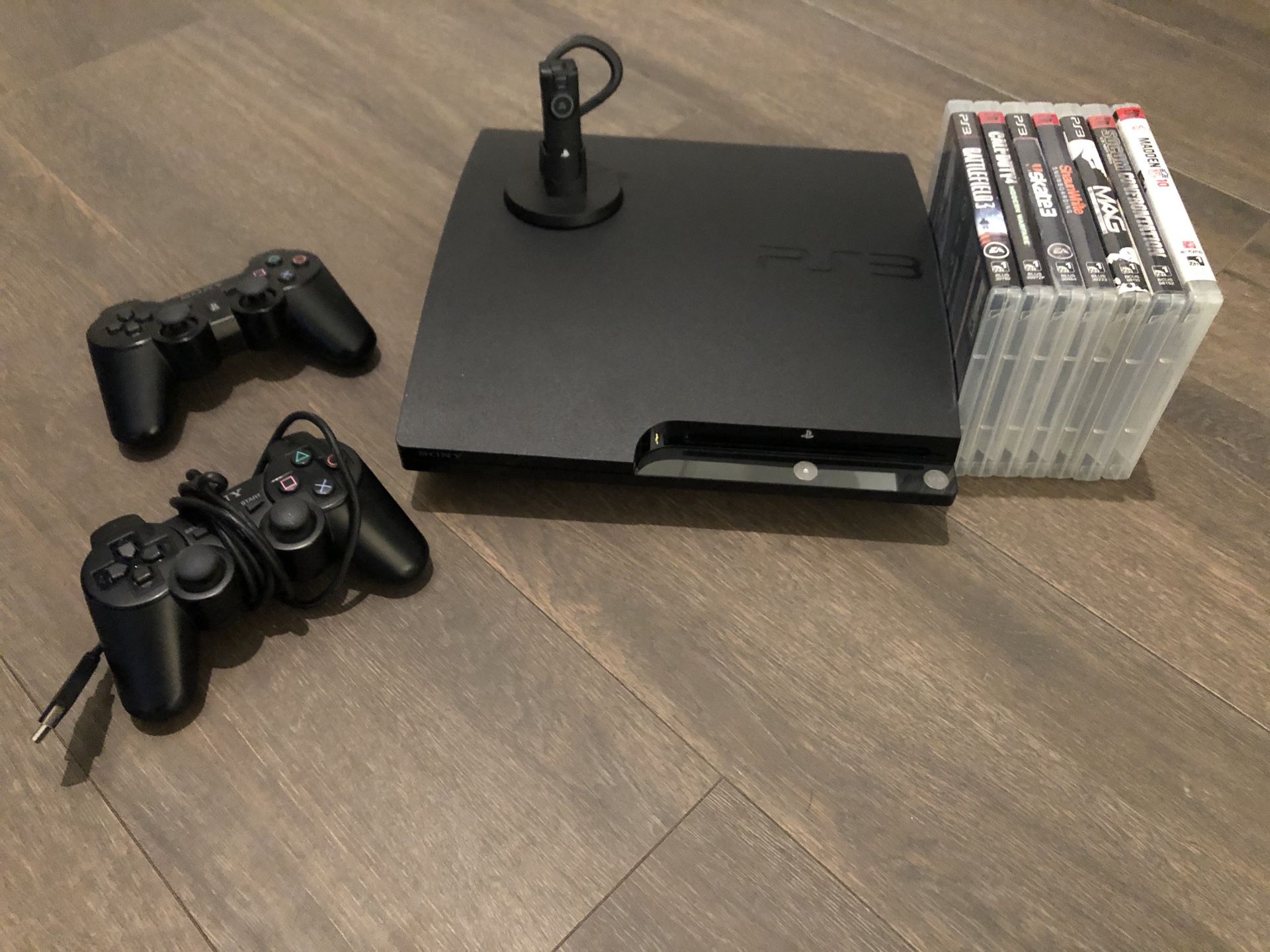 Slim design PS3 with all cables, 2 wireless controllers, wireless headphone and charger, and 7 games. Excellent condition!