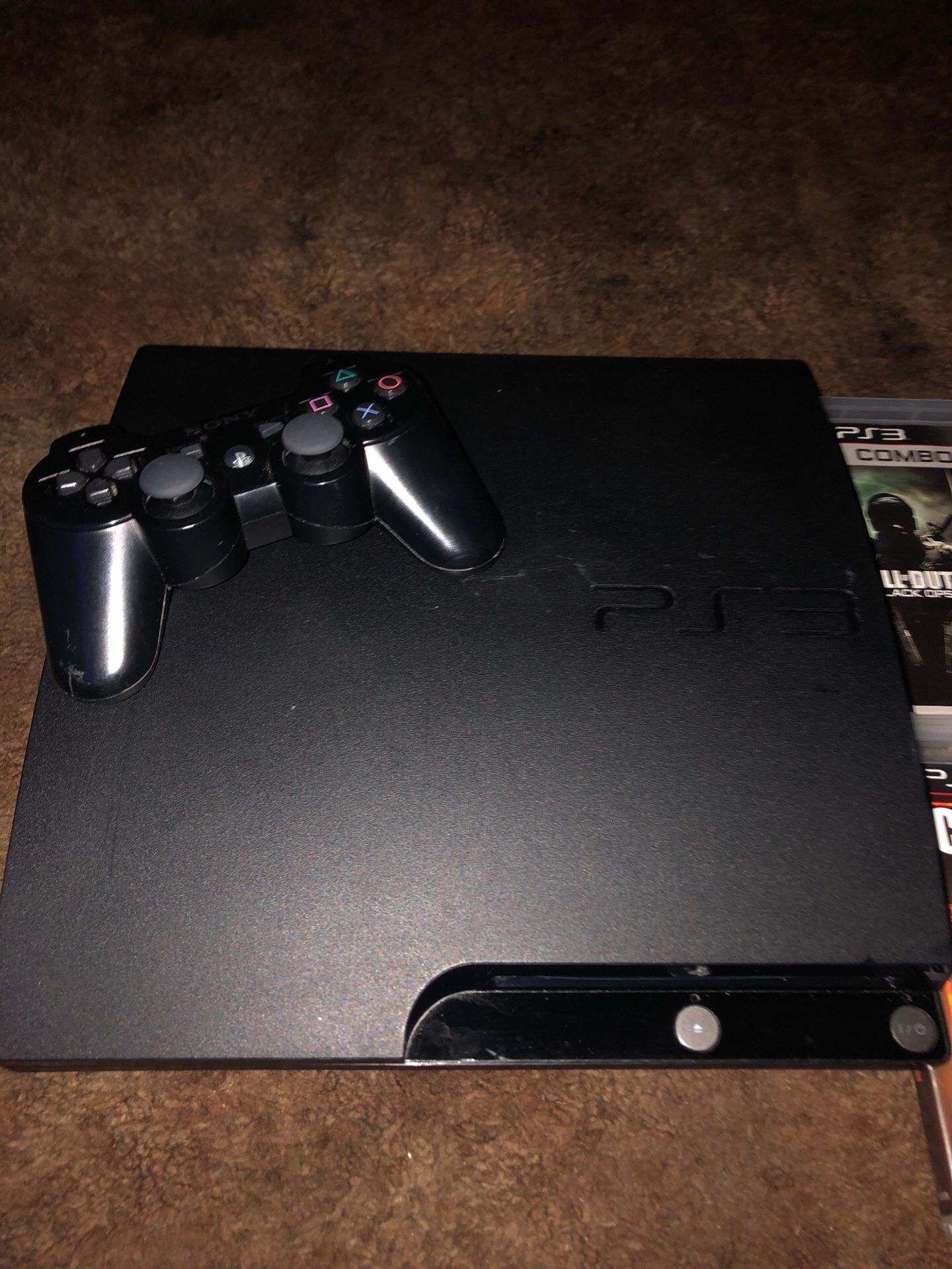 PS3 (controller and 4 games included)