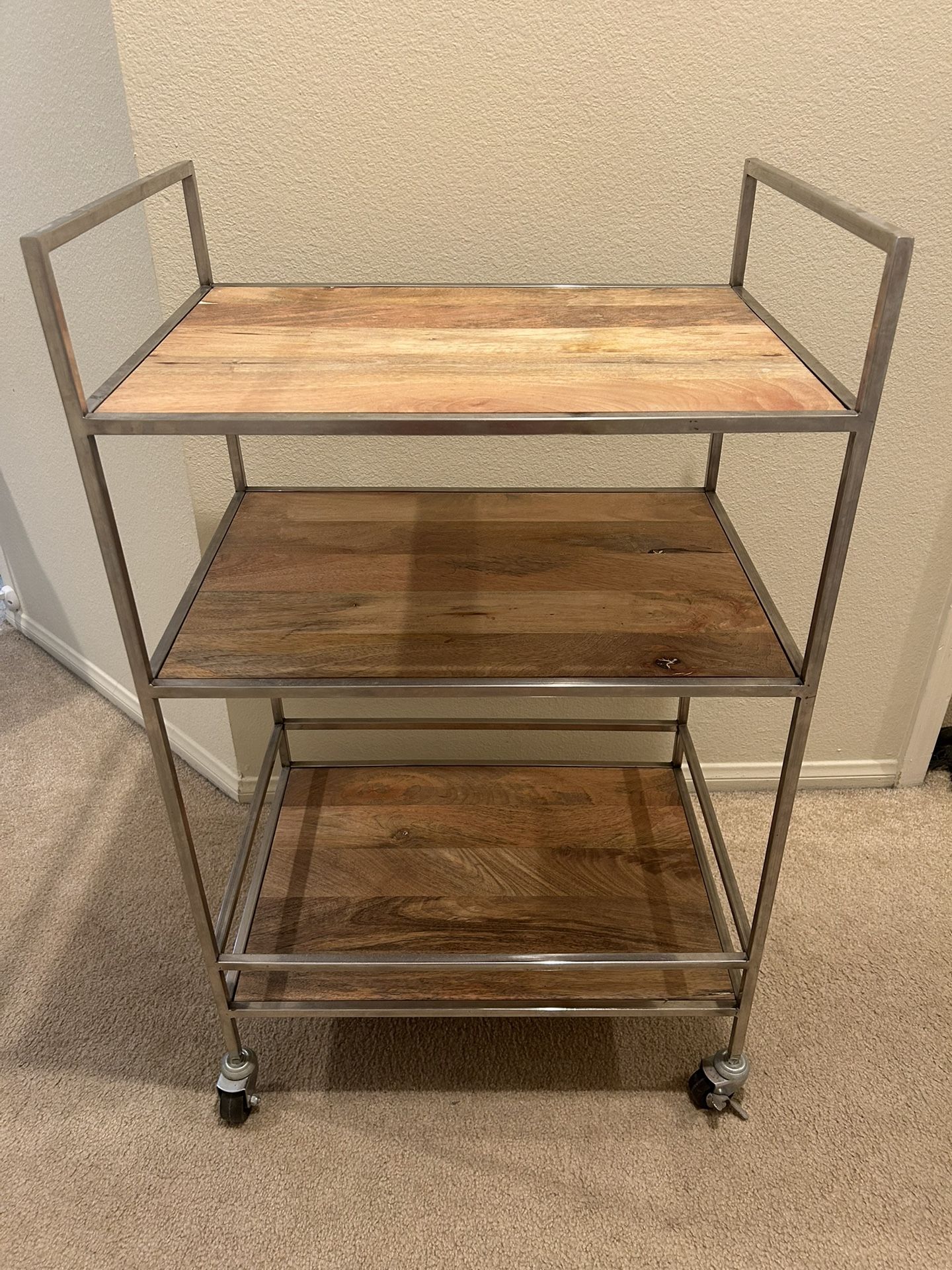 Vintage bar cart with solid wood shelves and brushed steel frame