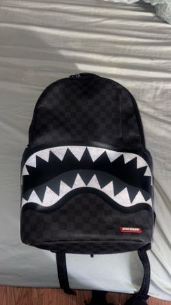 black spray ground backpack