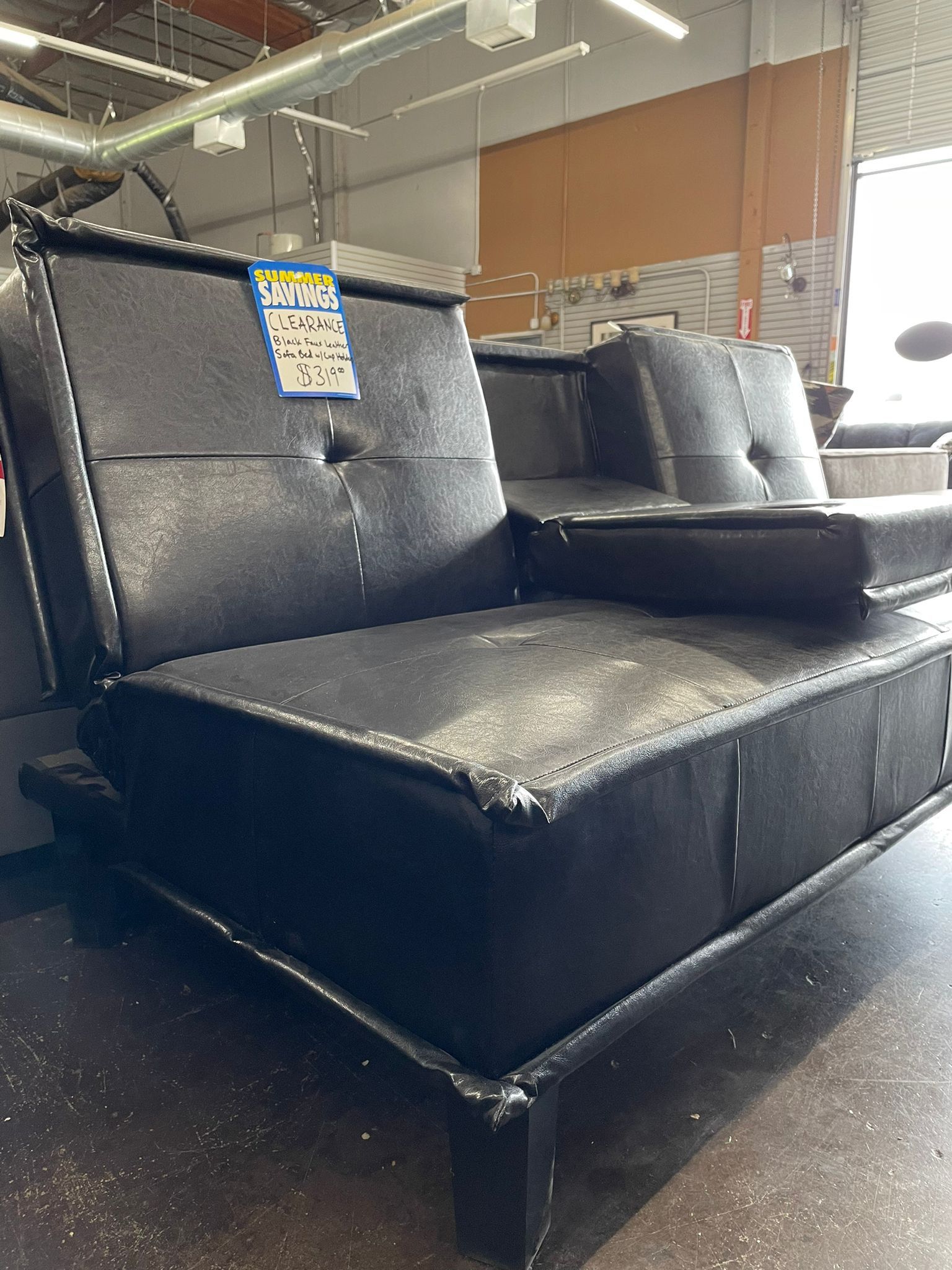 Black Leather Futon with Drop Down Console