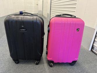  One pink Heys and one black Samsonite suite case  