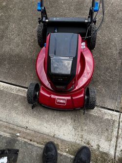 Toro 60V Max 22″ Recycler Personal Pace Electric Lawn Mower, branch chain saw and blower come with a battery and charger