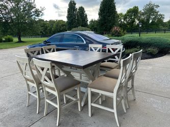 Stefan 9-Piece Counter Height Dining Set – Extendable Table & 8 X-Back Chairs