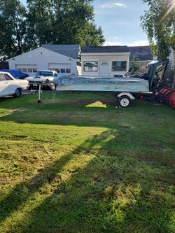 14ft. BoatAnd Gaterback Trailer $550.00. B.o.