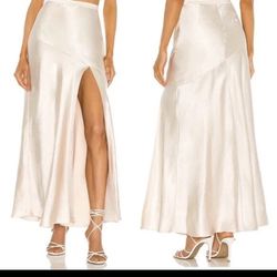 LPA Dalya Skirt Cream Satin Maxi Size XS  The LPA Dalya Skirt in cream satin is a stylish and elegant maxi skirt designed for women in size small. The