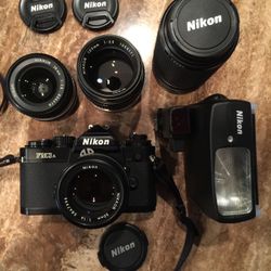 Nikon Fm3a camera package 50mm, 105mm,          28mm, & 70-210 zoom. With flash and case like new condition $1800.