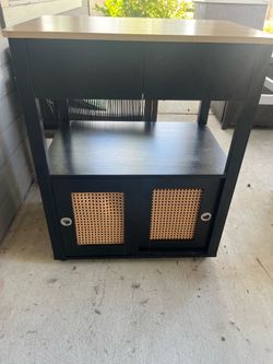Rolling kitchen island with storage cabinet