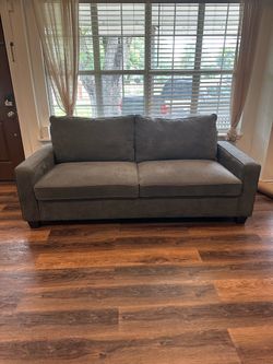 Gray Sofa couch Living Spaces