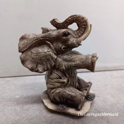 VINTAGE ADORABLE MINIATURE ELEPHANT IN A SITTING UP POSITION - DETAILS ARE AWESOME ON THIS FIGURINE