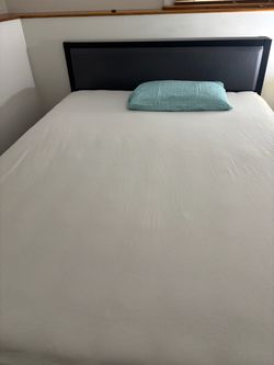 Bed Frame with Dark Upholstered Headboard