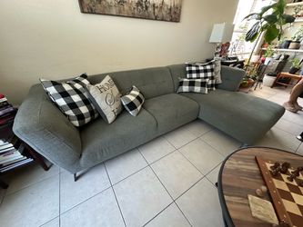 Grey sectional sofa and ottoman