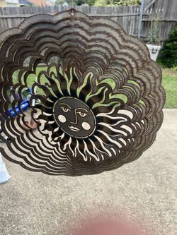 Hanging yard spinners