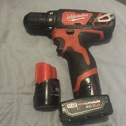Milwaukee  hammer drill and extra battery