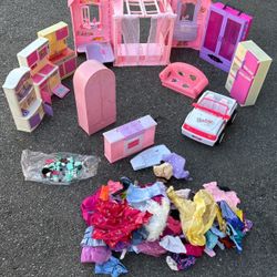 all these barbie doll accessories and clothes from different dolls