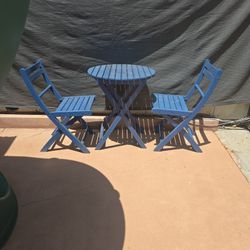 2 Chairs And Small Table Outdoors