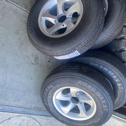New 4x ST trailer tire 215x75-14 with silver rim $600 No reply if you lowball